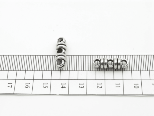 3MM ROUND 3 HOLE SPACER BEAD ON RULER