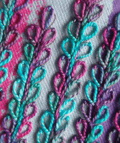 Close-up of delphinium embroidery kit in cerise