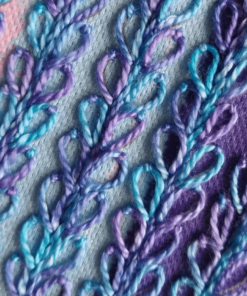 Close-up of delphinium embroidery kit in mauves