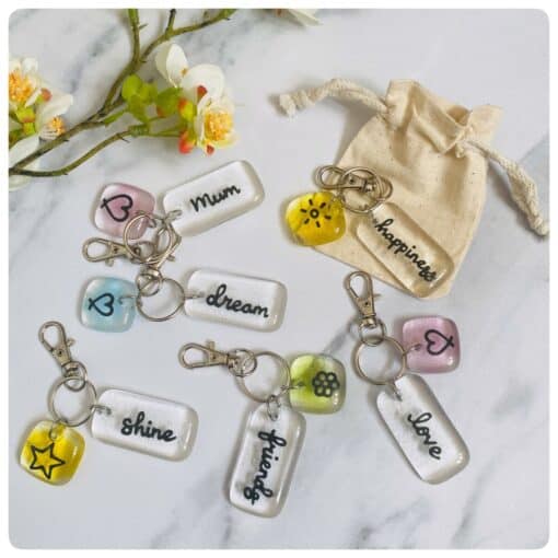 Collection of glass positivity keyrings