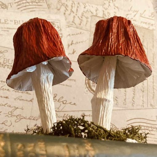 Paper red mushrooms in William Morris book