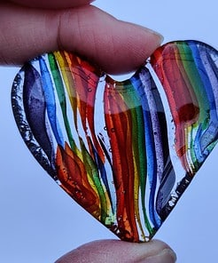 Rainbow coloured fused glass heart hug from Spinnaker Glass