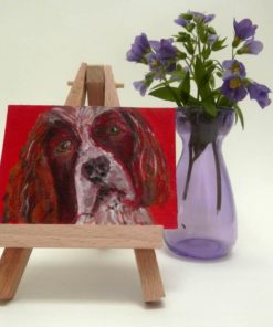 Miniature Springer Spaniel dog painting on wooden easel