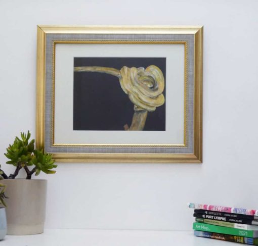 Snkae painting with gold coloured frame