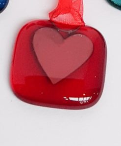 red glass with copper heart
