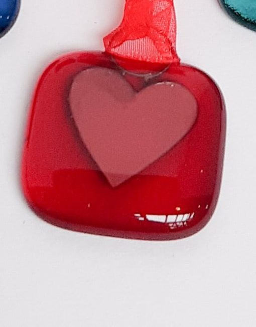red glass with copper heart