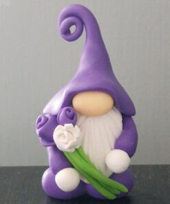 A purple clay gnome figurine holds two purple roses and one white rose, wearing a tall, curly hat.