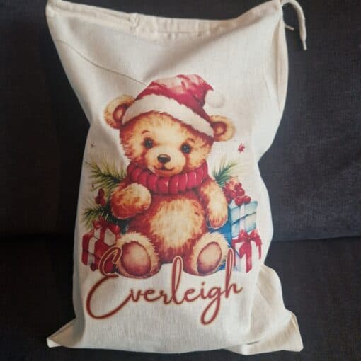 Unique teddy bear Christmas bag with a cute teddy bear print, perfect for kids, featuring personalized name "Everleigh".