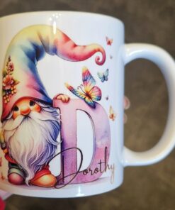 Mug featuring a colorful gnome with a rainbow hat, large letter 