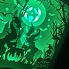 A green-lit Halloween scene with witches around a cauldron, spooky trees, bats, and gravestones.