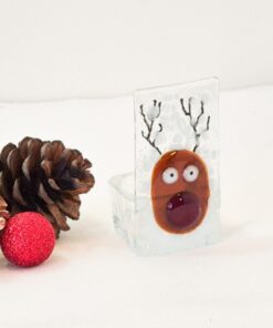 Festive glass reindeer ornament with pinecones and a red glitter ball on a white background.