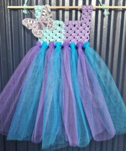 Handmade tutu dress with a crochet bodice in purple and mint, adorned with a butterfly, and blue and purple tulle skirt.