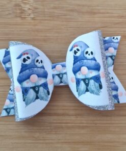 White hair bow with glitter edges, featuring blue gnome illustrations with skull faces and 