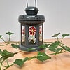 Grey lantern with red and white flowers