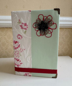 Mum book fold with a pale green and floral cover, with added embellishments and flowers.