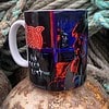 Artistic mug featuring a neon-style portrait and abstract design, set against coiled ropes.