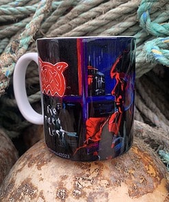 Artistic mug featuring a neon-style portrait and abstract design, set against coiled ropes.