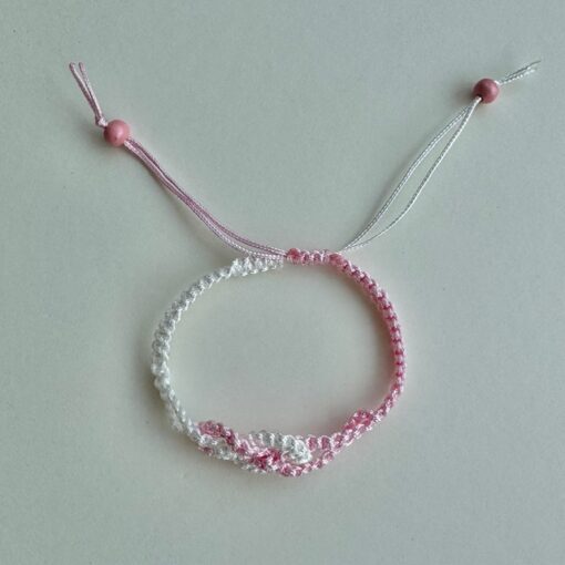 Macrame knotted bracelet - fully adjustable with a sliding knot. Made from 1mm pink and white braided nylon cord.