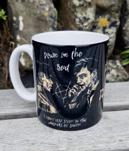 Black mug with artistic illustrations of men, featuring text "Down on the Beat" and "I won't lose sleep in the whispers of sheep.