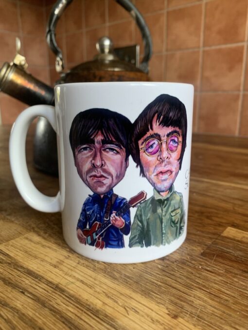 Cartoon mug illustration of two men, one with a guitar; background shows a vintage kettle on a wooden surface.