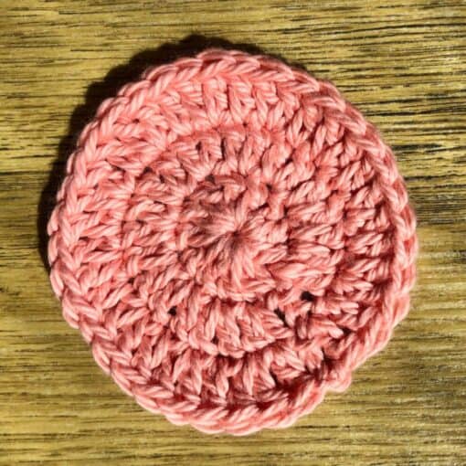 Set of 7 eco-friendly face scrubbies. A different colour for every day of the week. This shows a peach one