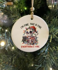 a white round ornament with a skeleton on it