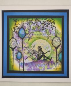 A whimsical fairy sits on the ground holding a glowing orb, surrounded by colorful flowers and foliage framed in blue and black.