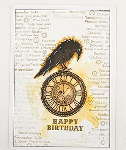 Steampunk-themed birthday card with a black crow perched on a clock, surrounded by vintage-style text and patterns. "Happy Birthday" at bottom.