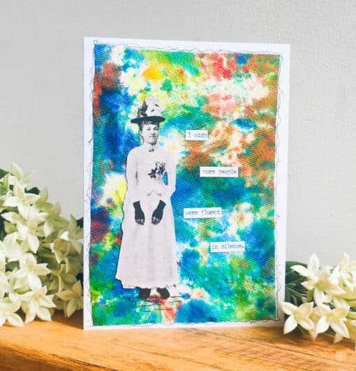 A colorful card with an old-fashioned photo of a woman and text saying, "I wish more people were fluent in silence," next to flowers.