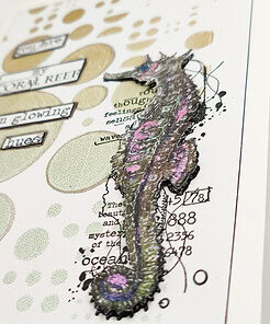 Artistic card with a colorful embossed seahorse and the text 