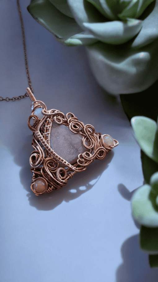 Bohemian vintage-style wire wrapped jewelry pendant with intricate design, ideal for unique wire wrap jewelry gifts.